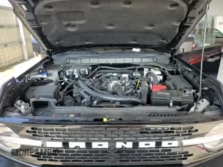 2024 Ford Bronco Wildtrak z VIN 1FMEE2BP0RLB04041, wystawiony jako Copart lot #69860285 z przebiegiem 2 449 mil mil oraz Szkoda całkowita • Salvage title. Historia ofert i sprzedaży dostępna na DreamBid. Obrazek 14.
