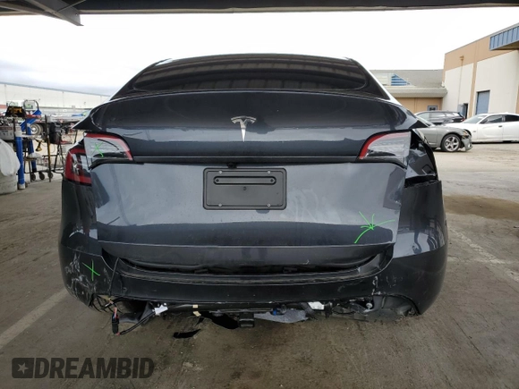 2025 Tesla Model Y Long Range with VIN 7SAYGDED2SF234388, listed as a Copart auction lot 47250965 with 3,702 mi miles and Salvage Title. Bid and sale history available at DreamBid. Image 6.