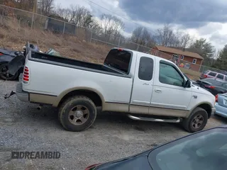 1999 Ford F-150 XL with VIN 1FTRX18LXXKA75357, listed as a IAAI auction lot 41630371 with 202,021 mi miles. Bid and sale history available at carsss.com. Image 14.