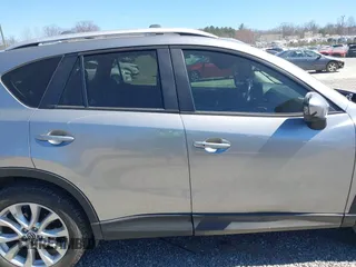 2014 Mazda CX-5 Grand Touring with VIN JM3KE4DY3E0368169, listed as a IAAI auction lot 41857976 with 127,853 mi miles. Bid and sale history available at carsss.com. Image 13.