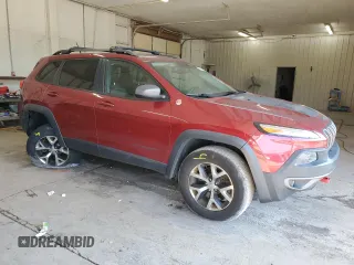 2015 Jeep Cherokee Trailhawk with VIN 1C4PJMBS1FW745928, listed as a Copart auction lot 62032585 with 132,559 mi miles and Salvage title. Bid and sale history available at DreamBid. Image 4.