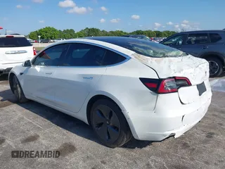 2020 Tesla Model 3 Standard Range Plus with VIN 5YJ3E1EA6LF799620, listed as a IAAI auction lot 42221643 with 55,458 mi miles and . Bid and sale history available at carsss.com. Image 3.