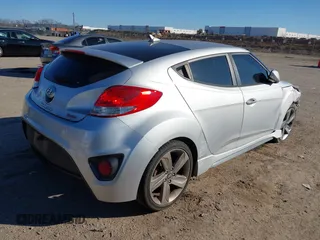 2013 Hyundai Veloster Turbo with VIN KMHTC6AE6DU162372, listed as a IAAI auction lot 41481820 with 105,650 mi miles and . Bid and sale history available at DreamBid. Image 4.