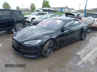 2022 Tesla Model S Plaid with VIN 5YJSA1E60NF460244, listed as a IAAI auction lot 41996403 with Not provided miles and . Bid and sale history available at DreamBid. Image 21.