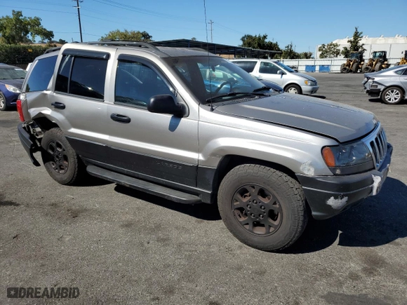 1999 Jeep Grand Cherokee Laredo with VIN 1J4GW58N4XC739465, listed as a Copart auction lot 76130544 with 195,649 mi miles and Salvage Title. Bid and sale history available at carsss.com. Image 4.
