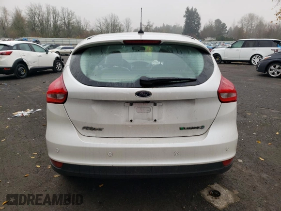 2015 Ford Focus Electric z VIN 1FADP3R41FL232835, wystawiony jako Copart lot #70969312 z przebiegiem 39 606 mil mil oraz . Historia ofert i sprzedaży dostępna na DreamBid. Obrazek 6.