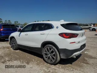 2023 BMW X2 sDrive28i with VIN WBXYH9C00P5V38984, listed as a Copart auction lot 50739725 with 47,287 mi miles and Salvage Title. Bid and sale history available at carsss.com. Image 2.