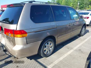 2004 Honda Odyssey EX-L with VIN 5FNRL18044B072819, listed as a IAAI auction lot 42441279 with 264,950 mi miles and . Bid and sale history available at DreamBid. Image 4.