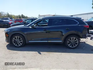 2016 Mazda CX-9 Grand Touring with VIN JM3TCBDY4G0113693, listed as a IAAI auction lot 41965857 with 152,403 mi miles and . Bid and sale history available at DreamBid. Image 15.