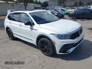 2023 Volkswagen Tiguan SE R-Line Black with VIN 3VVCB7AX3PM115373, listed as a IAAI auction lot 42257944 with 22,316 mi miles and . Bid and sale history available at DreamBid. Image 1.