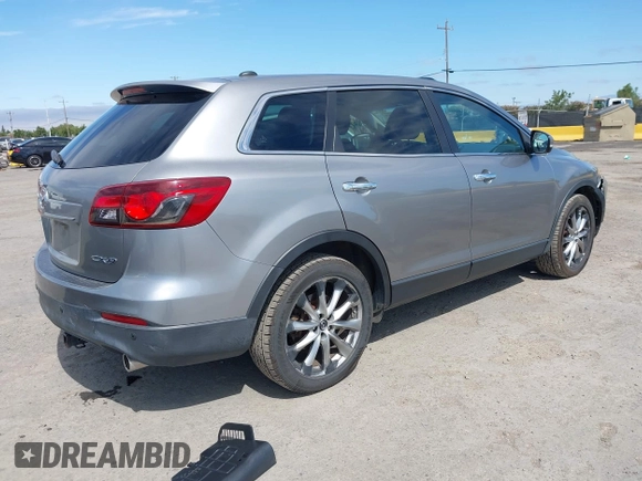 2014 Mazda CX-9 Grand Touring z VIN JM3TB2DVXE0432991, wystawiony jako IAAI lot #42826784 z przebiegiem 134 265 mil mil oraz . Historia ofert i sprzedaży dostępna na DreamBid. Obrazek 4.