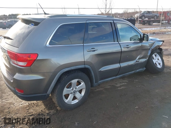 2011 Jeep Grand Cherokee 70th Anniversary with VIN 1J4RR4GT6BC715848, listed as a IAAI auction lot 41562152 with 119,910 mi miles. Bid and sale history available at carsss.com. Image 4.