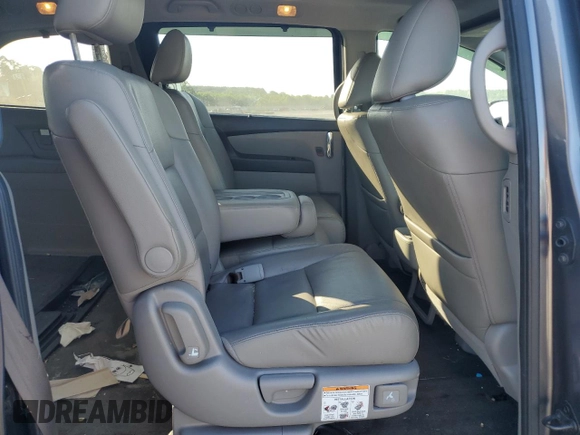 2014 Honda Odyssey Touring z VIN 5FNRL5H90EB007862, wystawiony jako Copart lot #60470005 z przebiegiem 135 686 mil mil oraz Czysty tytuł • Clean title. Historia ofert i sprzedaży dostępna na DreamBid. Obrazek 10.