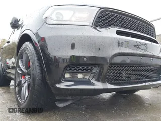2019 Dodge Durango SRT with VIN 1C4SDJGJXKC550910, listed as a IAAI auction lot 41497932 with 62,541 mi miles and . Bid and sale history available at DreamBid. Image 6.