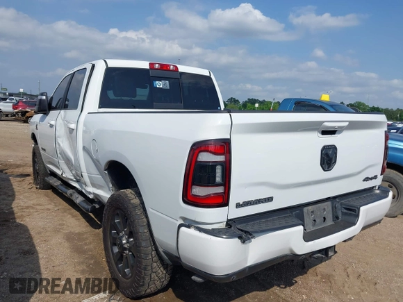 2023 Ram 2500 Laramie with VIN 3C6UR5FL3PG517960, listed as a IAAI auction lot 42128355 with 101,733 mi miles and . Bid and sale history available at DreamBid. Image 3.