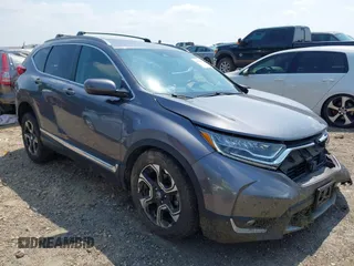 2018 Honda CR-V Touring z VIN 7FARW2H93JE050144, wystawiony jako IAAI lot #42596205 z przebiegiem 128 090 mil mil oraz . Historia ofert i sprzedaży dostępna na DreamBid. Obrazek 1.