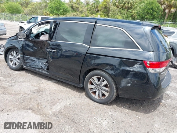 2014 Honda Odyssey Touring with VIN 5FNRL5H94EB057499, listed as a IAAI auction lot 41983956 with 158,573 mi miles and . Bid and sale history available at DreamBid. Image 3.