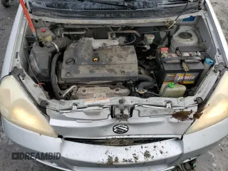 2004 Suzuki Aerio SX z VIN JS2RC61HX45253671, wystawiony jako Copart lot #85587754 z przebiegiem 171 436 mil mil oraz Szkoda całkowita • Salvage title. Historia ofert i sprzedaży dostępna na DreamBid. Obrazek 11.