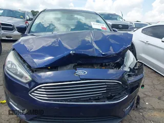 2016 Ford Focus Titanium z VIN 1FADP3J20GL208439, wystawiony jako IAAI lot #42145938 z przebiegiem 135 522 mil mil oraz . Historia ofert i sprzedaży dostępna na DreamBid. Obrazek 12.