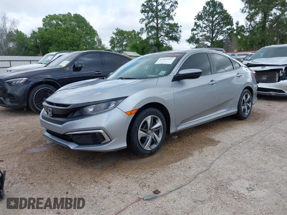 2019 Honda Civic LX with VIN 19XFC2F60KE043806, listed as a IAAI auction lot 41915894 with 123,141 mi miles and . Bid and sale history available at DreamBid. Image 18.