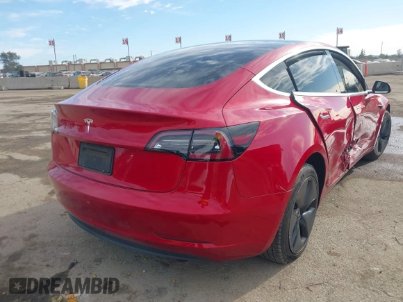 2020 Tesla Model 3 Standard Range Plus with VIN 5YJ3E1EA9LF718027, listed as a IAAI auction lot 41679320 with 68,987 mi miles. Bid and sale history available at carsss.com. Image 4.