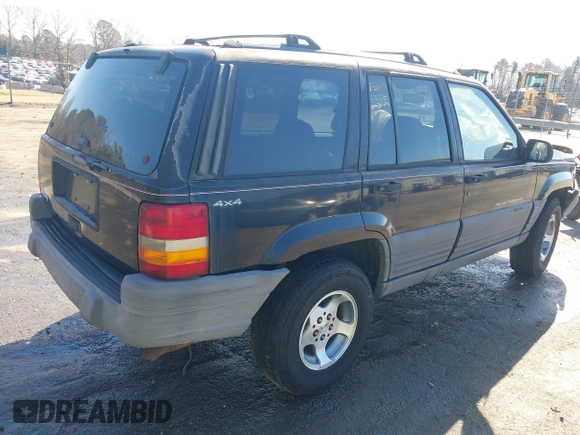1996 Jeep Grand Cherokee Laredo with VIN 1J4GZ58S9TC268615, listed as a IAAI auction lot 41527984 with 248,443 mi miles. Bid and sale history available at carsss.com. Image 4.
