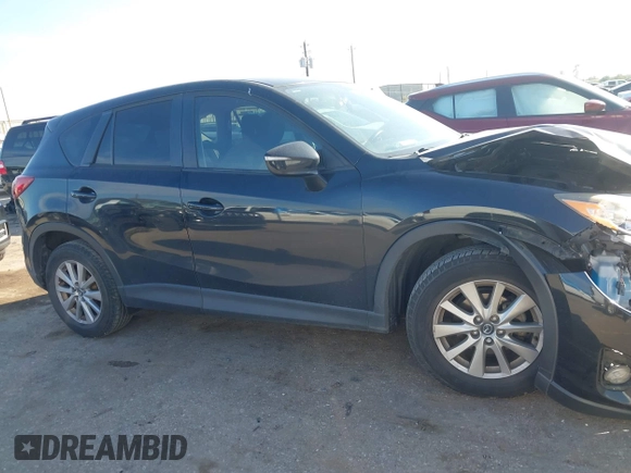 2016 Mazda CX-5 Touring with VIN JM3KE2CY6G0808992, listed as a IAAI auction lot 40969655 with 132,513 mi miles. Bid and sale history available at carsss.com. Image 13.