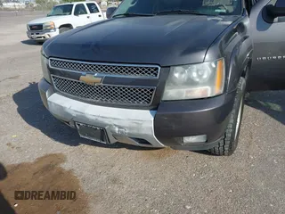 2011 Chevrolet Suburban LT with VIN 1GNSKJE34BR242629, listed as a IAAI auction lot 42043276 with 197,722 mi miles. Bid and sale history available at carsss.com. Image 6.