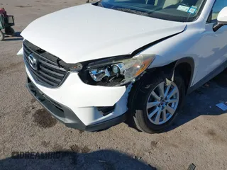 2016 Mazda CX-5 Sport with VIN JM3KE4BY8G0605504, listed as a IAAI auction lot 41866173 with 91,797 mi miles. Bid and sale history available at carsss.com. Image 6.