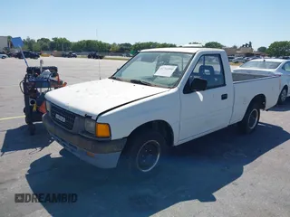 1994 Isuzu Pickup S z VIN JAACL11LXR7217702, wystawiony jako IAAI lot #41761090 z przebiegiem 198 468 mil mil oraz . Historia ofert i sprzedaży dostępna na DreamBid. Obrazek 2.