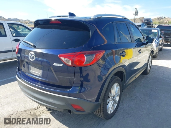 2014 Mazda CX-5 Grand Touring with VIN JM3KE2DY7E0376389, listed as a IAAI auction lot 42014946 with 126,081 mi miles. Bid and sale history available at carsss.com. Image 4.