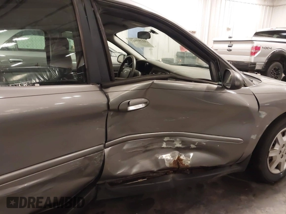 2006 Ford Taurus SE with VIN 1FAFP53U86A113947, listed as a IAAI auction lot 41753927 with 203,867 mi miles. Bid and sale history available at carsss.com. Image 17.