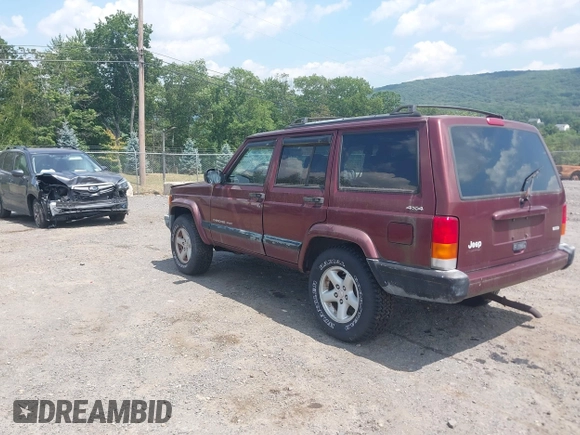 2000 Jeep Cherokee z VIN 1J4FF48S1YL256206, wystawiony jako IAAI lot #42835740 z przebiegiem 131 864 mil mil oraz . Historia ofert i sprzedaży dostępna na DreamBid. Obrazek 3.