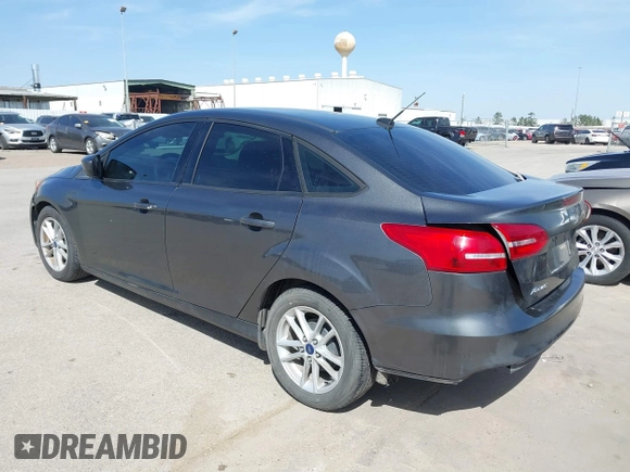 2018 Ford Focus SE with VIN 1FADP3F2XJL302358, listed as a IAAI auction lot 41807622 with 76,145 mi miles. Bid and sale history available at carsss.com. Image 3.
