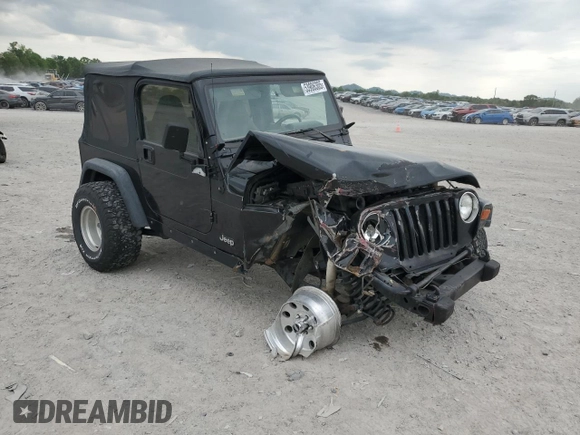 2000 Jeep Wrangler Sport with VIN 1J4FA49S9YP743515, listed as a Copart auction lot 53906305 with 247,349 mi miles and Salvage title. Bid and sale history available at DreamBid. Image 4.
