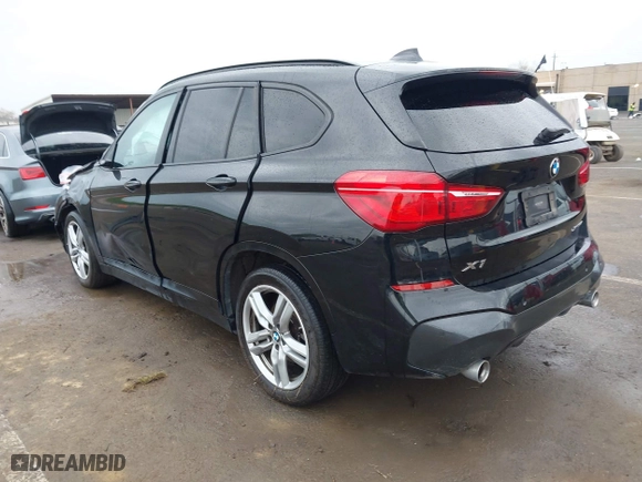 2021 BMW X1 xDrive28i with VIN WBXJG9C01M3M71033, listed as a IAAI auction lot 41723970 with 71,000 mi miles. Bid and sale history available at carsss.com. Image 3.
