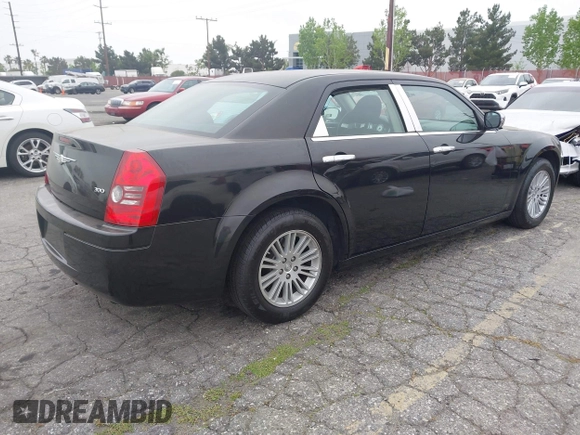 2009 Chrysler 300 LX with VIN 2C3KA43D19H506753, listed as a IAAI auction lot 42053199 with 106,092 mi miles. Bid and sale history available at carsss.com. Image 4.