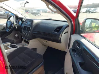 2014 Dodge Grand Caravan SXT with VIN 2C4RDGCG8ER245316, listed as a IAAI auction lot 41871425 with 150,361 mi miles and . Bid and sale history available at DreamBid. Image 5.