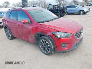 2016 Mazda CX-5 Grand Touring with VIN JM3KE4DY8G0729446, listed as a IAAI auction lot 41871207 with 89,258 mi miles. Bid and sale history available at carsss.com. Image 1.