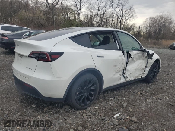 2023 Tesla Model Y Long Range with VIN 7SAYGDEE0PF746778, listed as a Copart auction lot 52704965 with 19,047 mi miles and Salvage Title. Bid and sale history available at DreamBid. Image 3.