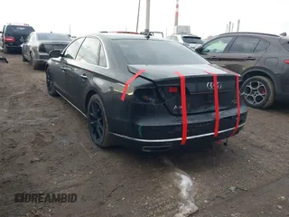 2015 Audi A8 L 4.0T with VIN WAU32AFD5FN026108, listed as a IAAI auction lot 41652860 with 148,253 mi miles. Bid and sale history available at carsss.com. Image 3.