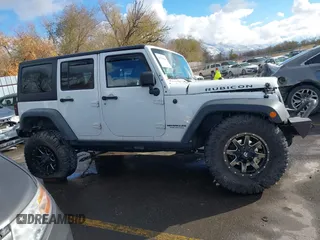 2014 Jeep Wrangler Unlimited Rubicon with VIN 1C4BJWFG2EL264792, listed as a IAAI auction lot 40938380 with 145,886 mi miles. Bid and sale history available at carsss.com. Image 14.