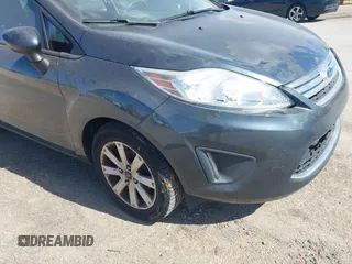 2011 Ford Fiesta SE z VIN 3FADP4BJ5BM219052, wystawiony jako IAAI lot #42297403 z przebiegiem 108 302 mil mil oraz . Historia ofert i sprzedaży dostępna na DreamBid. Obrazek 12.