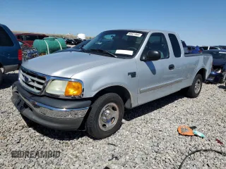 2004 Ford F-150 XL with VIN 2FTRX17W04CA89831, listed as a Copart auction lot 66821544 with 154,467 mi miles and Salvage title. Bid and sale history available at DreamBid. Image 1.