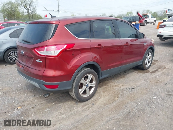 2014 Ford Escape SE with VIN 1FMCU0GX2EUB60526, listed as a IAAI auction lot 42060469 with 128,796 mi miles. Bid and sale history available at carsss.com. Image 4.