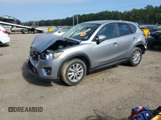 2015 Mazda CX-5 Touring with VIN JM3KE2CY7F0435914, listed as a Copart auction lot 61885704 with 0 mi miles and Salvage Title. Bid and sale history available at carsss.com. Image 1.