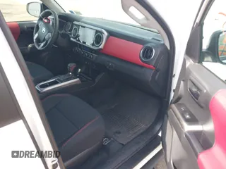 2023 Toyota Tacoma SR with VIN 3TMCZ5AN2PM642205, listed as a IAAI auction lot 42167945 with 10,595 mi miles and . Bid and sale history available at DreamBid. Image 5.