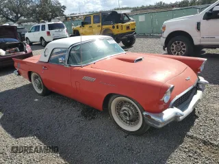 1957 Ford Thunderbird with VIN D7FH395675, listed as a Copart auction lot 77234434 with 15,312 mi miles and Salvage Title. Bid and sale history available at DreamBid. Image 4.