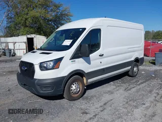 2023 Ford Transit Cargo with VIN 1FTBR2C8XPKA33372, listed as a IAAI auction lot 41735299 with 56,777 mi miles and . Bid and sale history available at DreamBid. Image 21.