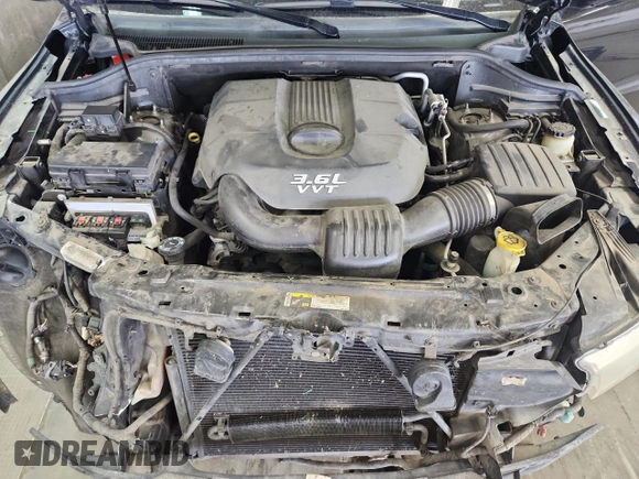 2013 Dodge Durango Crew z VIN 1C4RDJDGXDC672239, wystawiony jako Copart lot #59227905 z przebiegiem 167 982 mil mil oraz Szkoda całkowita • Salvage title. Historia ofert i sprzedaży dostępna na DreamBid. Obrazek 12.